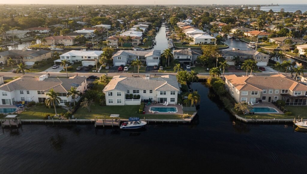 Row of well-maintained South Florida residential rental properties representing a managed multi-property portfolio