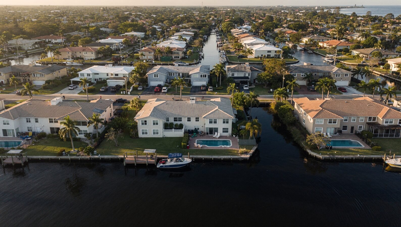 Row of well-maintained South Florida residential rental properties representing a managed multi-property portfolio